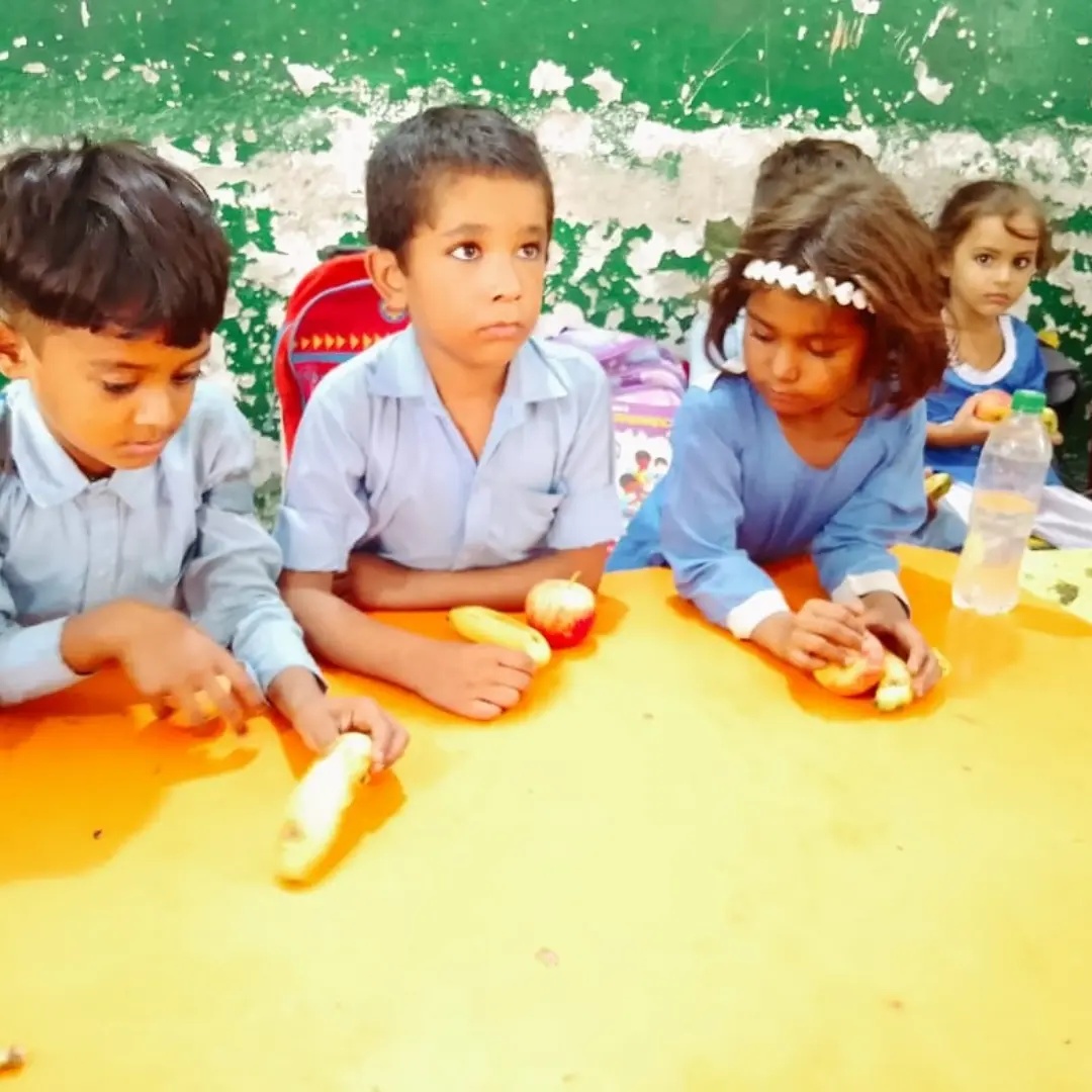 Fruit Distribution Drive #01 at Shakarganj Adopted School (SAS) #01- GGPS SML Campus on August 28th - 2026. Students and staff members received apples and bananas.