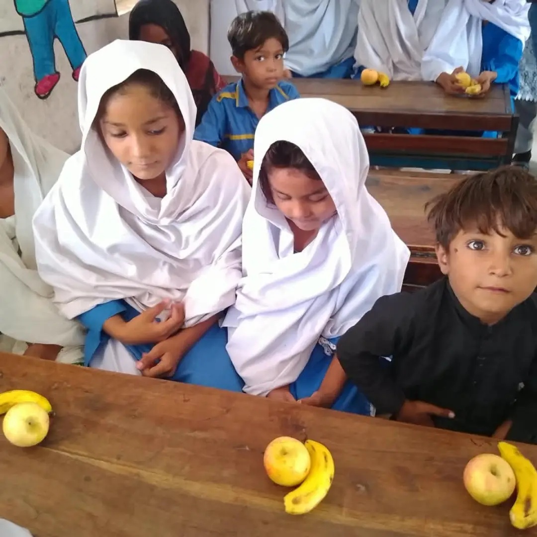 Fruit Distribution Drive #02 at Shakarganj Adopted School (SAS) #02- GGPS Chah Blochan on September 14th - 2026. Students and staff members received apples and bananas.