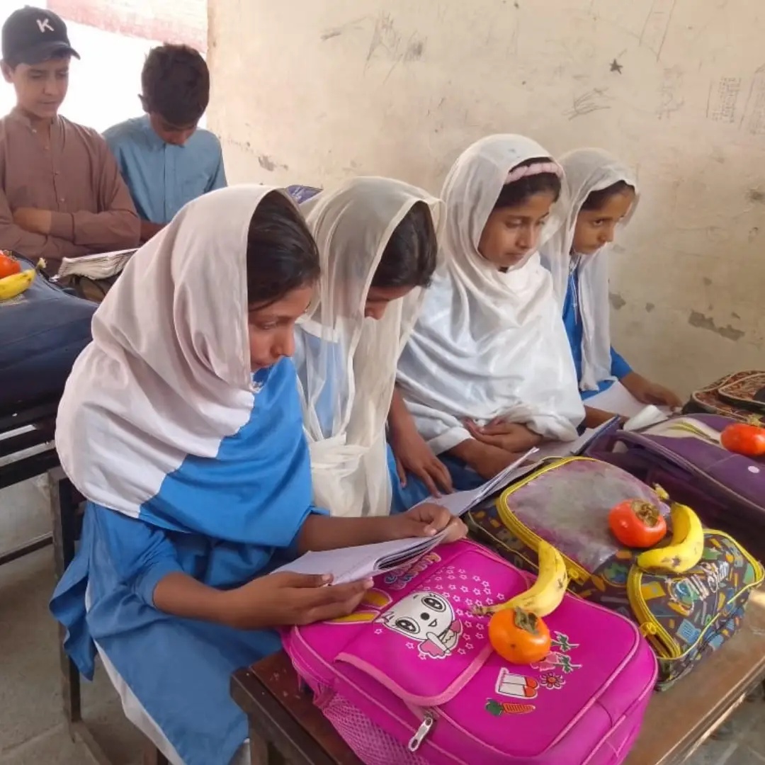 Fruit Distribution Drive #05 at Shakarganj Adopted School (SAS) #03- Government Girls Insaf School on October 21st - 2026. Students and staff members received apples and Sharons.